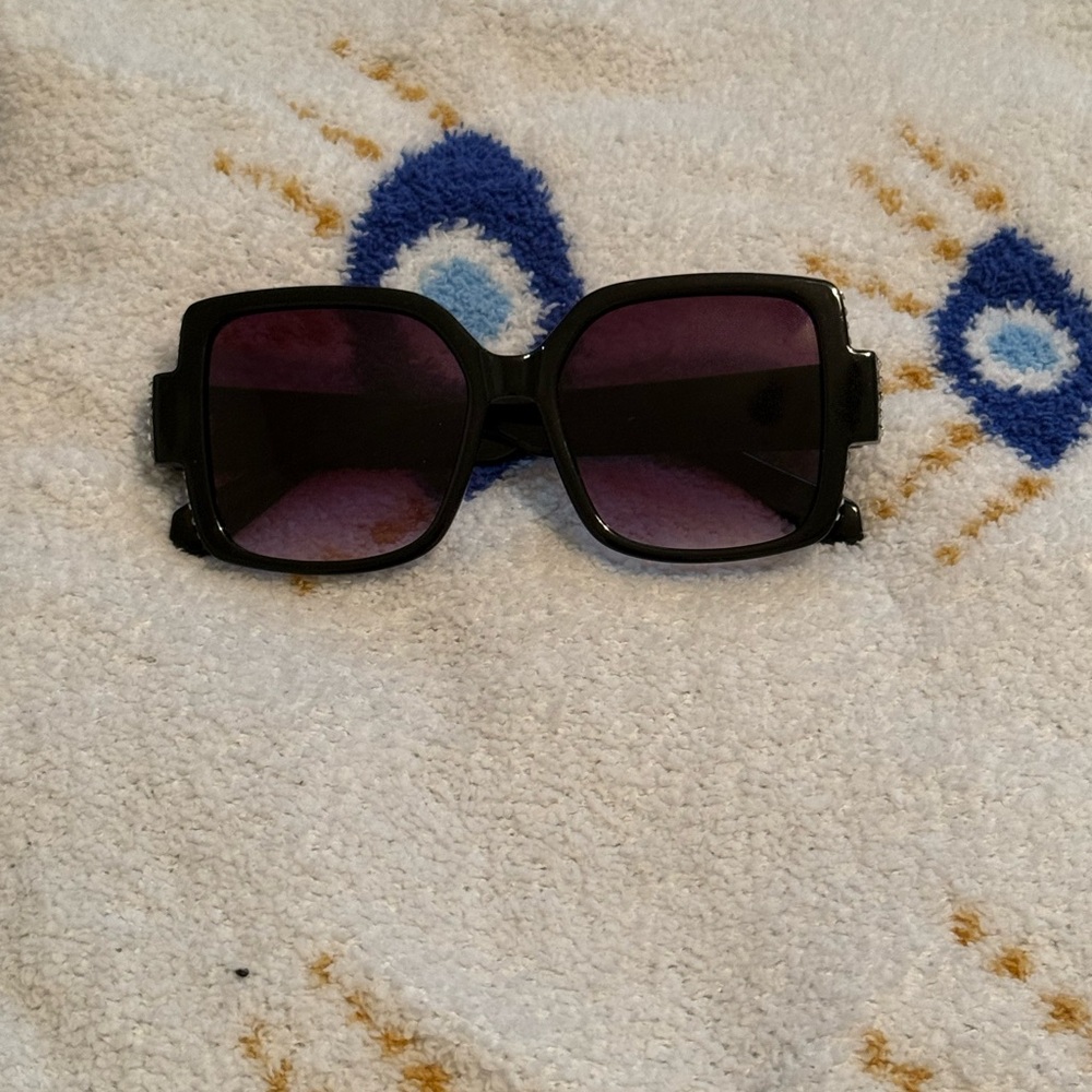 Black square sunglasses with silver jewels on the side